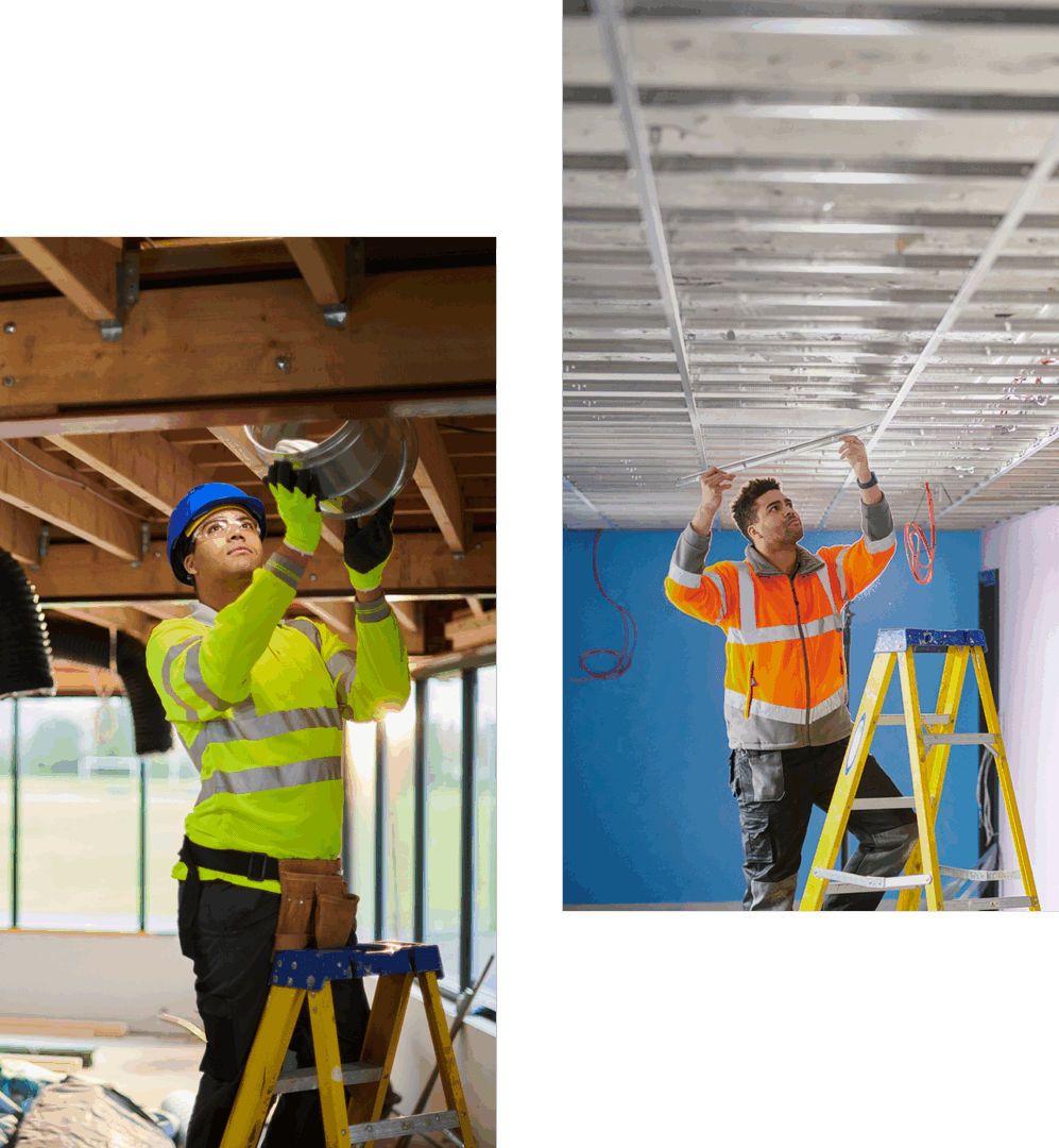 Workers in reflective gear on ladders